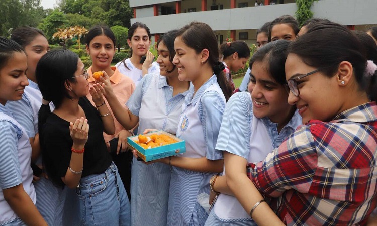 Students celebrate DBSE Classes X and XII results