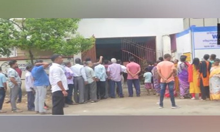 Voters line up outside a polling both to cast their votes for West Bengal Panchayat Elections