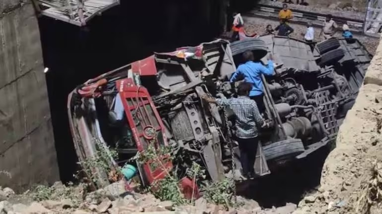 Bus falls on railway track