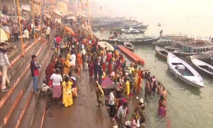 Devotees take holy dip in river Ganga in Varanasi