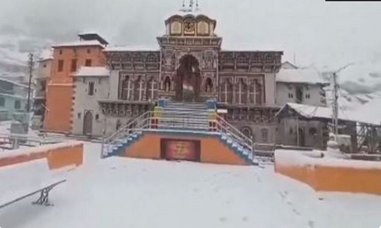 A white sheet of snow is visible on the premises of Badrinath Temple