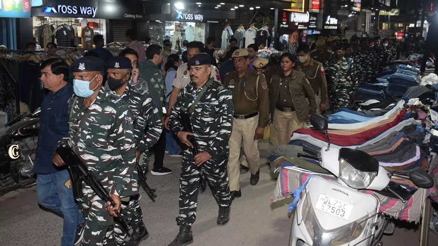 Delhi police take out flag march